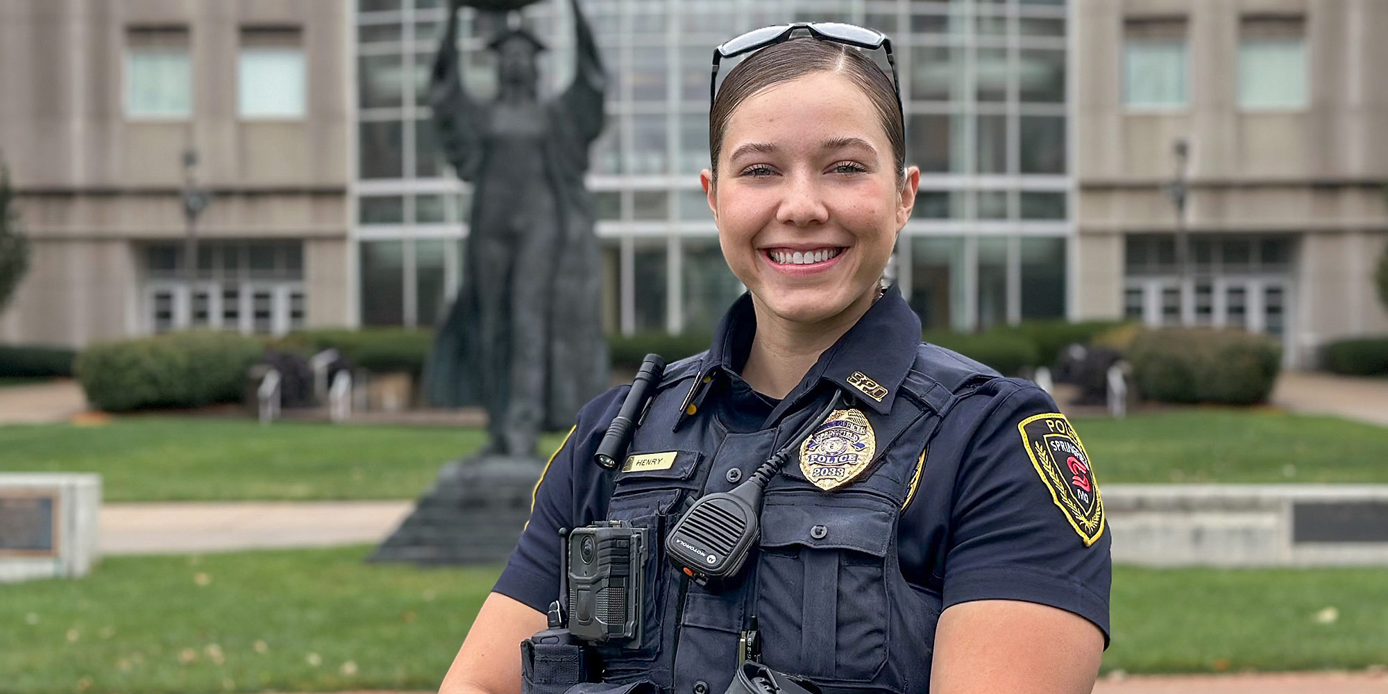 outdoor portrait of female police officer on a university campus